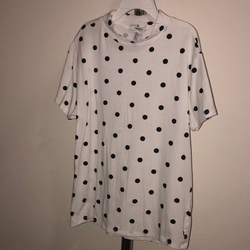 White shirt with black polka dots.
